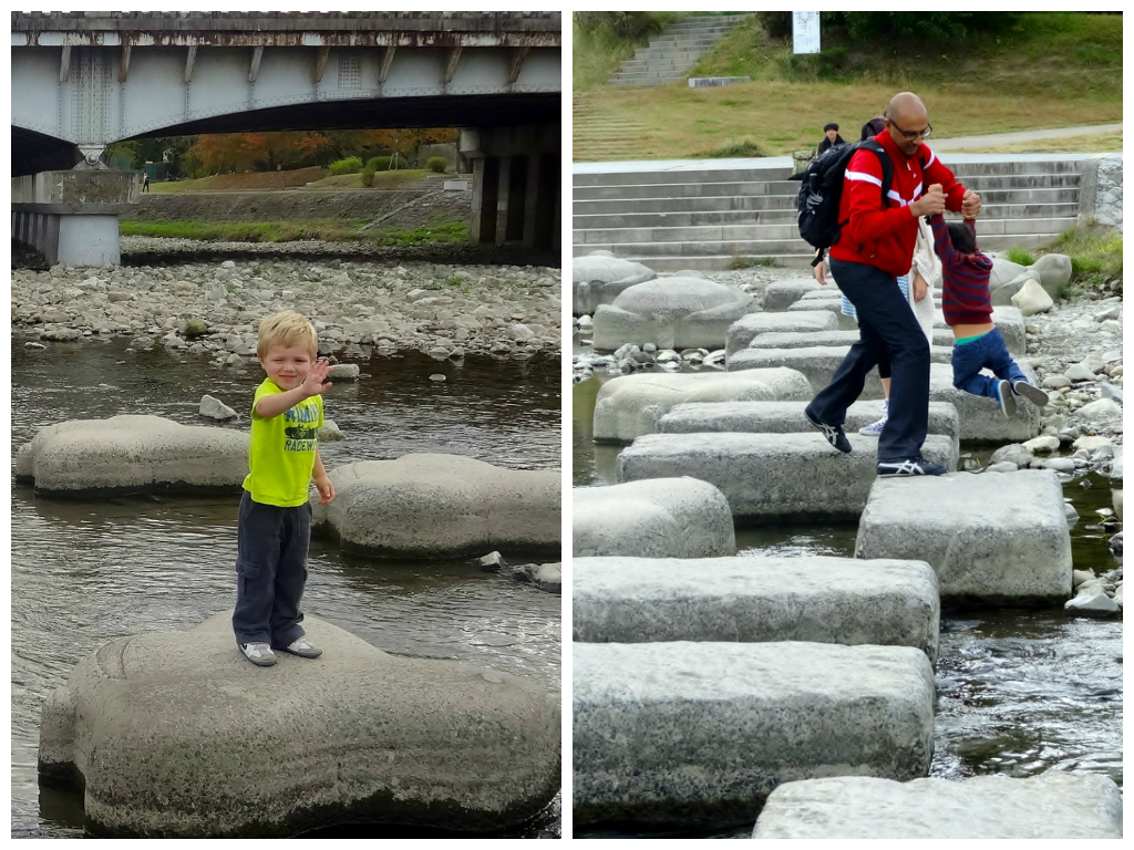 Kids enjoying stepping stone river crossing in Kyoto