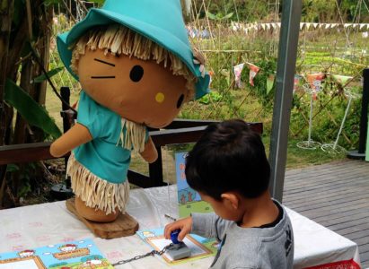 Collecting stamps at the Hello Kitty Organic Farm Hong Kong