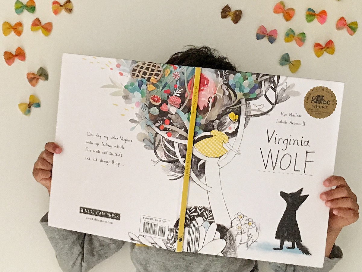 Reading Virginia Wolf by Kyo Maclear and Isablle Arsenault surrounded by butterflies