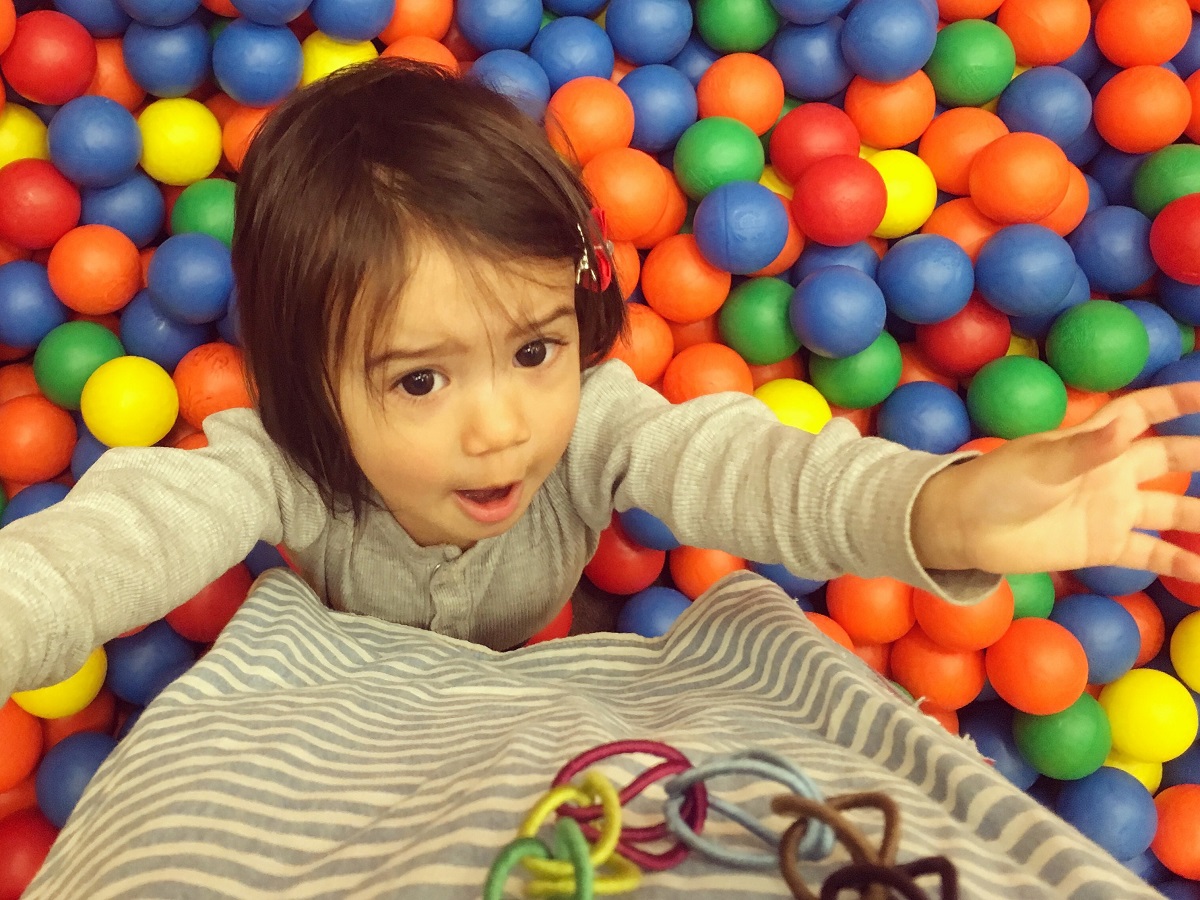 Playing in a ball pit at a Detsky Koutek in Prague