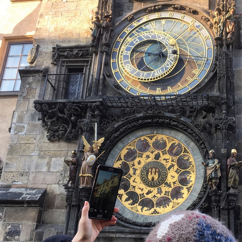 Watching the procession of the Twelve Apostles at the Astronomical clock. One of the 74 fun things to do in Prague with kids. The Little Adventurer. 