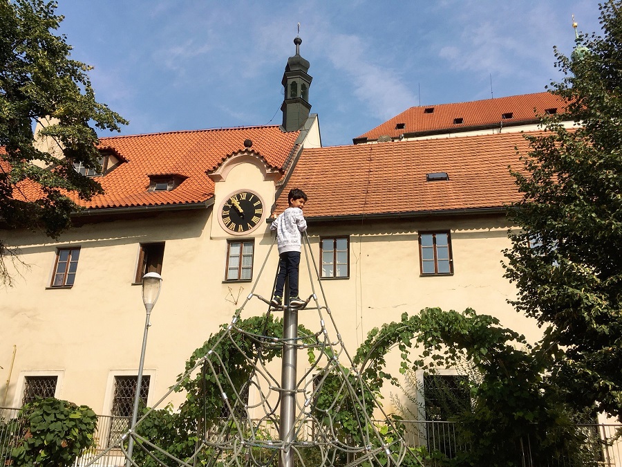 Climbing at the playground in Fransican Gardens Prague