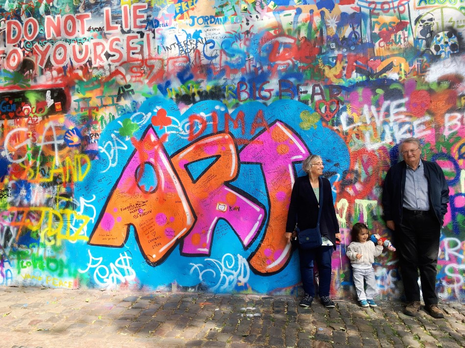 Posing by the John Lennon Wall in Prague