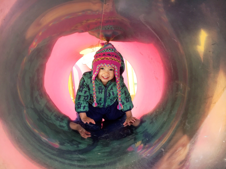 Crawling through tunnels in Stromovka's playground in Prague