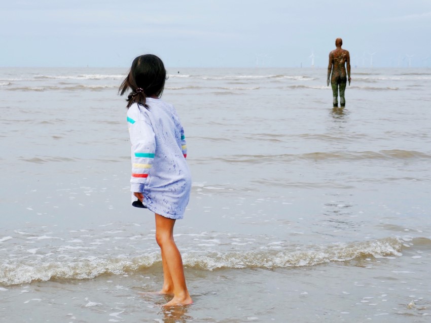 Playing at the beach alongside Antony Gormley sculptures - one of the family-friendly walks in North West England